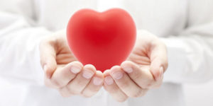 Tai Chi hands holding healthy heart